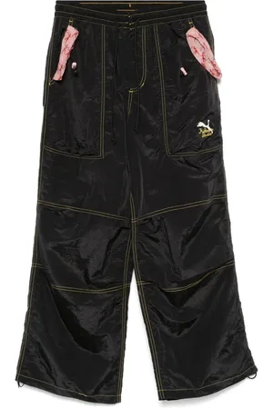 PUMA X KidSuper logo-print trousers