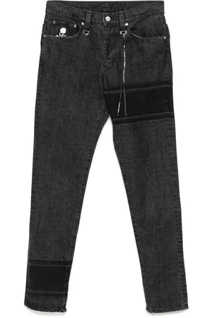 MASTERMIND Logo-embroidered skinny jeans