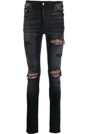 AMIRI Ripped skinny-fit jeans