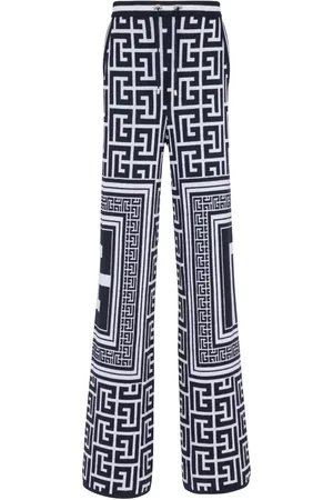 Balmain Monogram-pattern straight-leg trousers