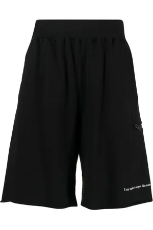 UNDERCOVER Slogan-print cotton track shorts