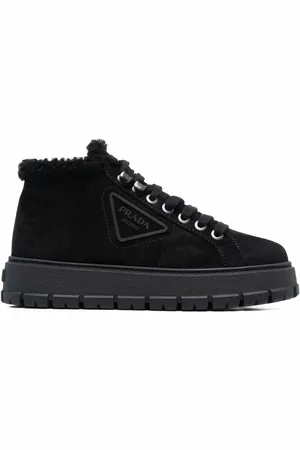 Prada Logo plaque shearling ankle boots