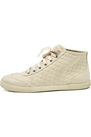 Gucci Monogram-embossed leather high-top sneakers