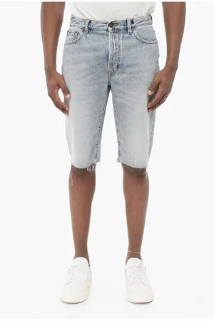 Saint Laurent Light Wash Denim Shorts with Fringed Bottom