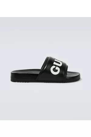 Gucci Logo leather slides