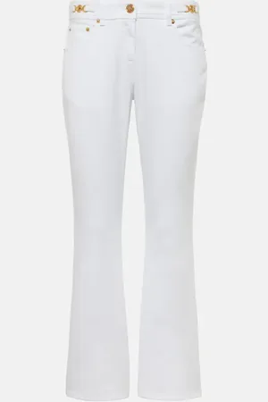 VERSACE Embellished low-rise flared jeans