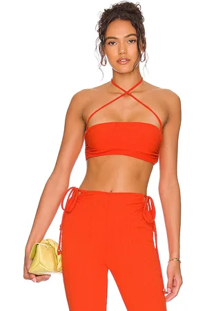 Sydne Style wears camila coehlo for revolve orange top with louis