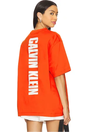 Calvin Klein Relaxed Vertical Logo Tee in Red. - size L (also in M, S, XL/1X)
