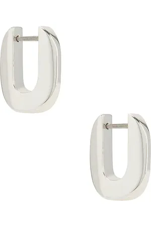 Jenny Teeni Toni Huggie Earrings in Metallic .