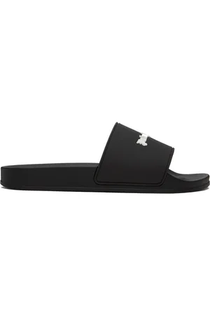 https://images.fashiola.com/product-list/300x450/ssense/552062550/black-new-logo-pool-slides.webp