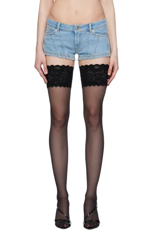 Lacy black top, denim shorts with a high waist and black tights