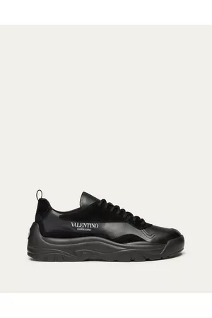 VALENTINO GARAVANI Men Low Top & Lifestyle Sneakers - GUMBOY CALFSKIN SNEAKER Man BLACK 39.5